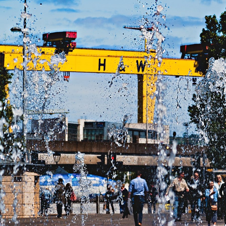 people walking near yellow structure